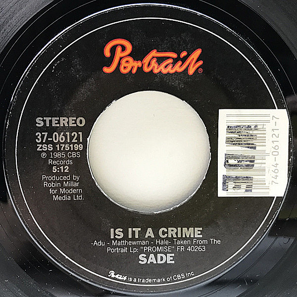 レコードメイン画像：7インチ USオリジナル SADE Is It A Crime? ('85 Portrait) アルバム未収録／Punch Drunk 収録 シャーデー『Promise』からのシングルカット