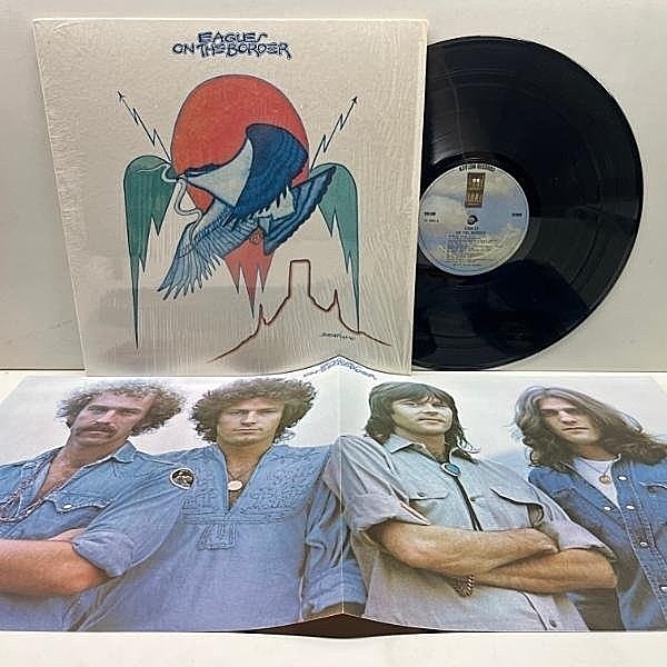 レコードメイン画像：Rare!!【ポスター付き】シュリンク美品!! 初版 7E規格 雲ラベ USオリジナル EAGLES On The Border ('74 Asylum) Best Of My Love, Ol' '55