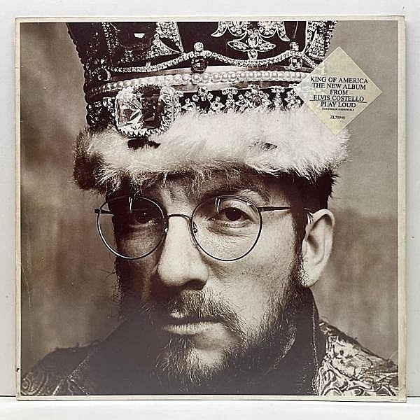 レコードメイン画像：良好品!! '86年 EUオリジナル 初版 ZL規格 手書きSF刻印 ELVIS COSTELLO King Of America (F-Beat) w/Hype Sticker エルヴィス・コステロ