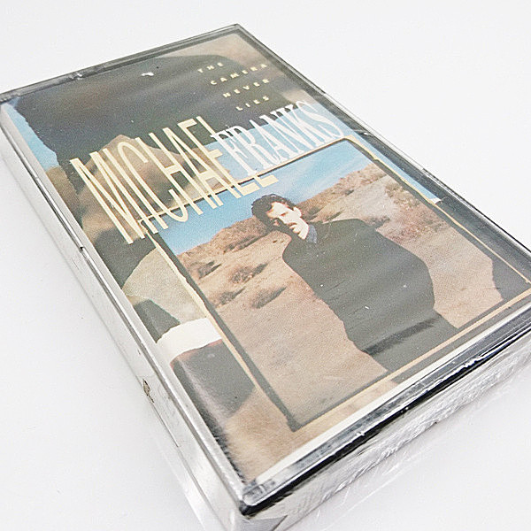 レコードメイン画像：MICHAEL FRANKS The Camera Never Lies ('87 Warner) マイケル・フランクス CASSETTE TAPE／カセットテープ