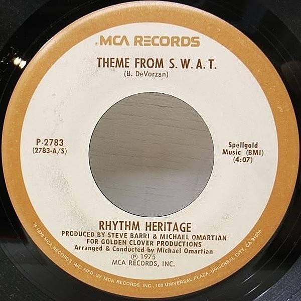 レコードメイン画像：美盤!! RHYRHM HERITAGE Theme From S.W.A.T. (MCA) リズム・ヘリテイジ 反逆のテーマ／ロッキーのテーマ収録 ドラムブレイク 7" 45RPM.